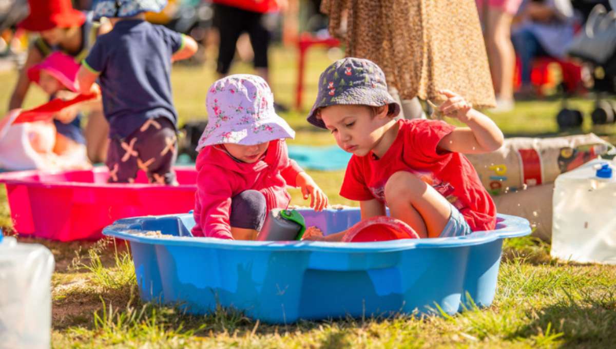 A toddler enjoying messy play